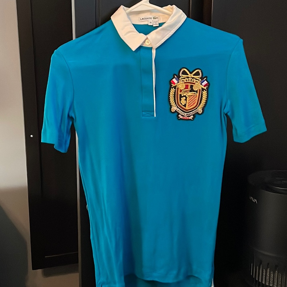 Lacoste women’s size 36 polo shirt in teal. Excellent condition. Used once.